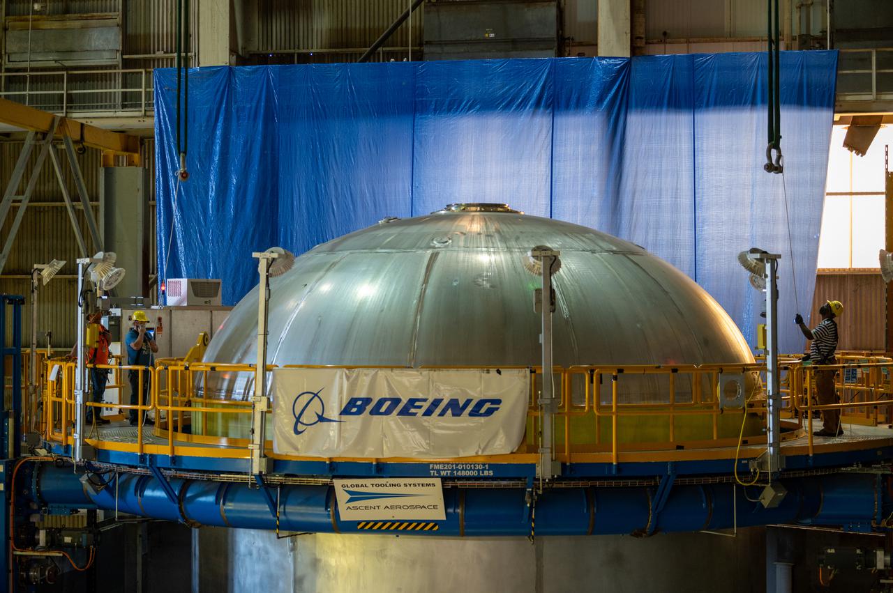 This image highlights the liquid hydrogen tank that will be used on the core stage of NASA’s Space Launch System rocket for Artemis II, the first crewed mission of NASA’s Artemis program. The tank is being built at NASA’s Michoud Assembly Facility in New Orleans. The SLS core stage is made up of five unique elements: the forward skirt, liquid oxygen tank, intertank, liquid hydrogen tank, and the engine section. The liquid hydrogen tank holds 537,000 gallons of liquid hydrogen cooled to minus 423 degrees Fahrenheit and sits between the core stage’s intertank and engine section. The liquid hydrogen hardware, along with the liquid oxygen tank, will provide propellant to the four RS-25 engines at the bottom of the cores stage to produce more than two million pounds of thrust to launch NASA’s Artemis missions to the Moon. Together with its four RS-25 engines, the rocket’s massive 212-foot-tall core stage — the largest stage NASA has ever built — and its twin solid rocket boosters will produce 8.8 million pounds of thrust to send NASA’s Orion spacecraft, astronauts and supplies beyond Earth’s orbit to the Moon and, ultimately, Mars. Offering more payload mass, volume capability and energy to speed missions through space, the SLS rocket, along with NASA’s Gateway in lunar orbit, the human landing system, and Orion spacecraft, is part of NASA’s backbone for deep space exploration and the Artemis lunar program. No other rocket can send astronauts in Orion around the Moon in a single mission.